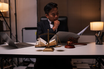 Male lawyer working on legal matters in a law office	