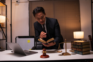 Male lawyer working on legal matters in a law office	