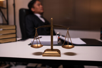 Male lawyer working on legal matters in a law office	