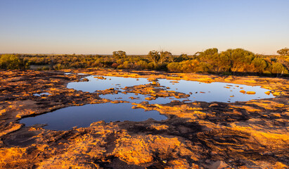 Reflections in a pond in the outback of the Murchison Region of Western Australia