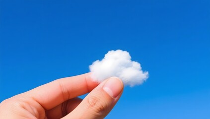 Hand Holding Fluffy Cloud Against Clear Blue Sky Background