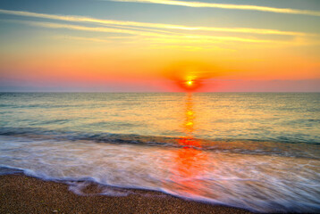 Beautiful summer sunrise over the beach