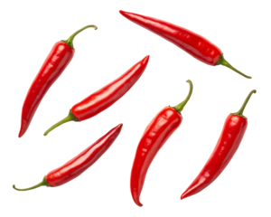 Several ripe red chili peppers scattered and arranged artistically on a dark background isolated on white background isolated on transparent background