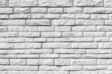 Obraz premium A stark white brick wall with a rough and uneven texture provides a clean minimalist background