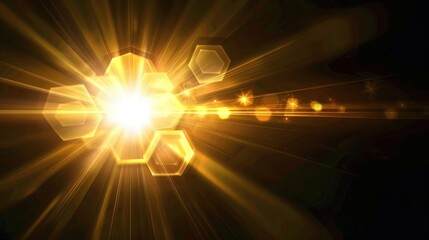 Cinematic golden light flare with radiant sunburst and hexagonal lens effect on black background