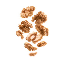 Peeled from the shell, walnut kernels levitate on a white background