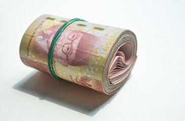 Indonesian Rupiah Paper Bill, a stack of money, IDR100.000, roll of money