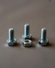 Industrial Bolts and Nut Arrangement on Gray Minimalist Background