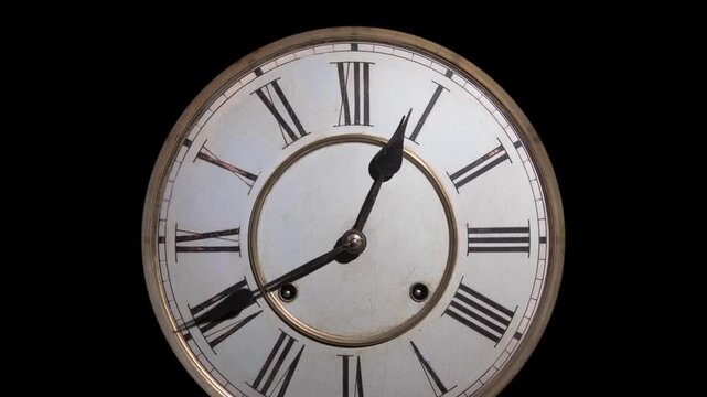 Old fashioned clock zoom vintage watch roman numerals spinning in dark black background timelapse