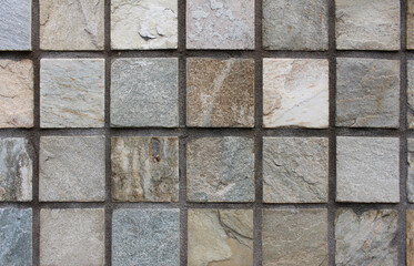 Close up of colorful square tile wall texture background.