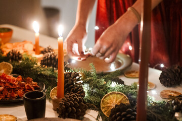Close-Up of Hands Serving Food on a Festive Christmas Decorated Table