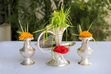 Tika and Jamara placed in a silver utensil with barley sprouts, money, and fruits for the Vijaya Dashami ceremony during Dashain festival in Nepal.