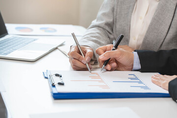Financial consult planning investor asses and present to client, Close up shot client and advisor review investment strategy in the office.