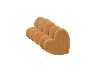 Piles of heart-shaped homemade sweet cookies isolated on a white background