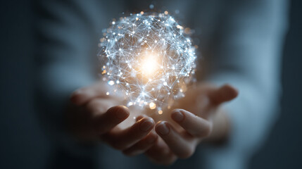 Hands cradle a luminous sphere of interconnected data points symbolizing global communication and innovative technology