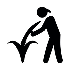 Silhouette of a person tending to a plant with a tool