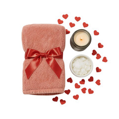 Romantic self care still life featuring towel candle and heart confetti on dark background