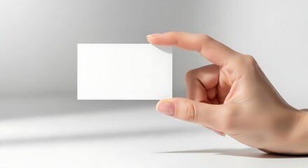 Obraz premium Hand presenting blank white card