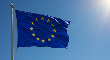 European union flag waving in the wind against clear blue sky