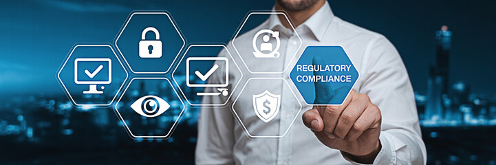 Man touching regulatory compliance icon representing business standards and legal requirements