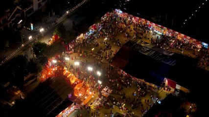 Aerial view of lots of people showing the population in india showing temple and navratri or durga pooja celebration