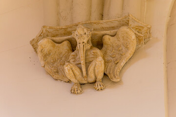 Mudejar corbel with a carved stone figure inside the Church of San Pedro in Teruel, as a historical heritage site © Uvamenfoto