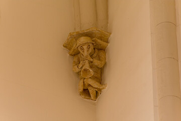 Mudejar corbel with a carved stone figure inside the Church of San Pedro in Teruel, as a historical heritage site © Uvamenfoto