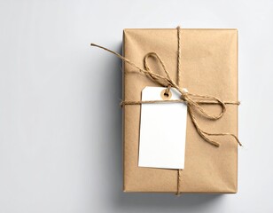 Brown paper package tied with string, blank tag attached