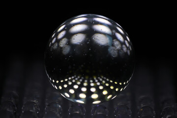 Glowing Sphere Reflecting Abstract Patterns: Modern Dark Background Aesthetic