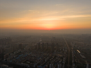 Suizhou City Hubei Province China horizon stretches under a hazy sky during sunset.