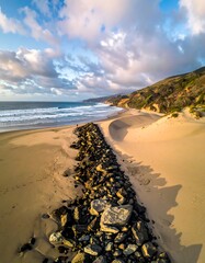 Coastal beach with rock barrier