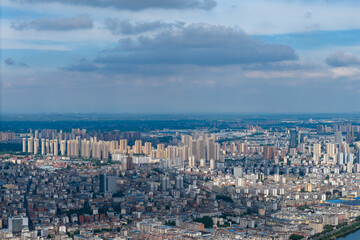Suizhou City, Hubei Province, China shows buildings stretching across the landscape under a cloudy sky, offering a vast urban view.