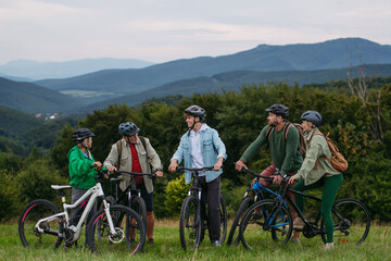 Family biking adventure in nature. Cycling trip during autumn day.