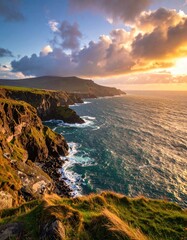 Dramatic coastal sunset over rugged cliffs