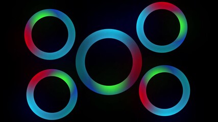 Glowing neon rings in sequence with red, green, blue on black background. Five glowing neon rings in a row with red, green, and blue colors on black background. - Powered by Adobe