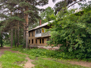 An old two-story wooden abandoned derelict building slated for demolition