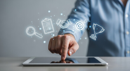 Businessman interacting with digital tablet, engaging with holographic icons representing analytics, teamwork, achievement, and strategy, illustrating modern technology in professional settings