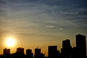 City Sunset Silhouette with Golden Sky.