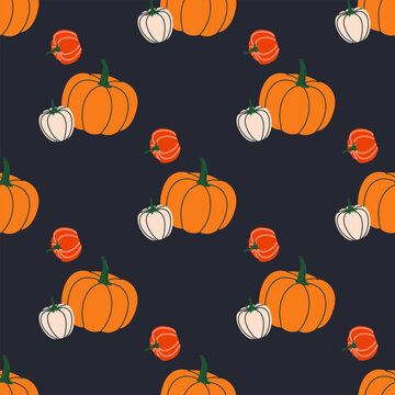 Pumpkins and gourds creating a fall festive seamless pattern on a dark background