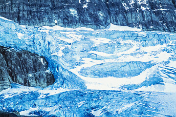 Glacier with icefall on a mountain at high altitude