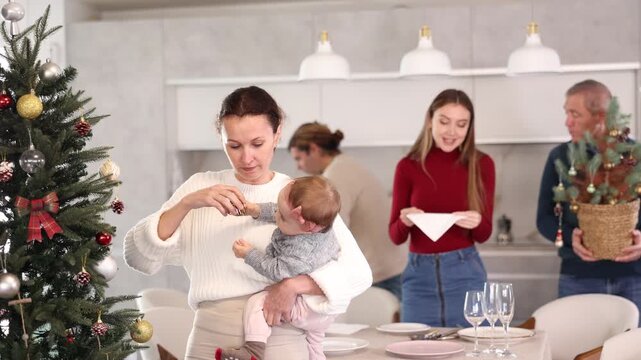 Woman decorating Christmas tree, family preparing for Christmas. Woman decorating Christmas tree. High quality 4k footage