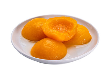 High angle view of canned peach halves in syrup in white ceramic dish.