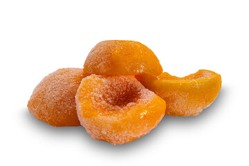 Closeup view of frozen canned peach halves isolated on white background with clipping path.