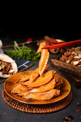 Glazed Chicken Wing Tips with Chopsticks and Asian Spices Traditional Food Photography