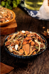 Star anise cinnamon allspice spice collection in rustic bowl perfect match for hot cooking with aromatic leaves and herbs on wooden background