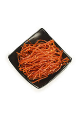 Fototapeta premium Handmade Spicy Hunan Dried Meat Strips Traditional Chinese Snack Food in Black Bowl