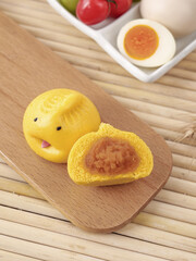 Adorable Yellow Cartoon Dim Sum Buns with Sweet Bean Paste Filling on Wooden Board