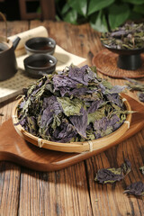 Dried Purple Perilla Leaves from Guangxi in Traditional Bamboo Basket with Tea Set