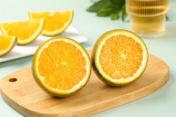 Fresh Orange Halves on Wooden Cutting Board - Healthy Citrus Fruit Preparation