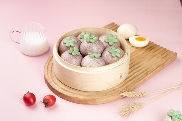 Purple Steamed Buns with Green Flowers in Bamboo Steamer - Asian Food Collection